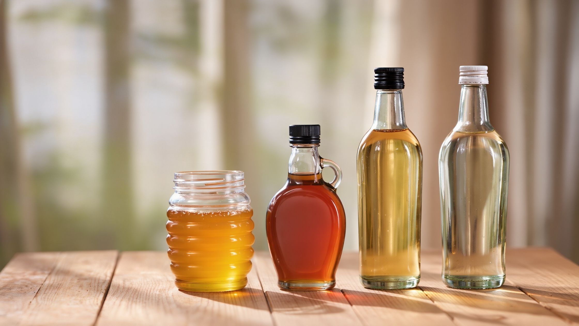 Various natural sweeteners displayed on a kitchen counter.